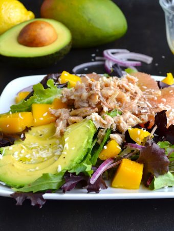 Tropical Crab Salad - mixed greens topped with creamy avocado, sweet mango, crunchy red onion and crab with a tropical dressing! | @tasteLUVnourish