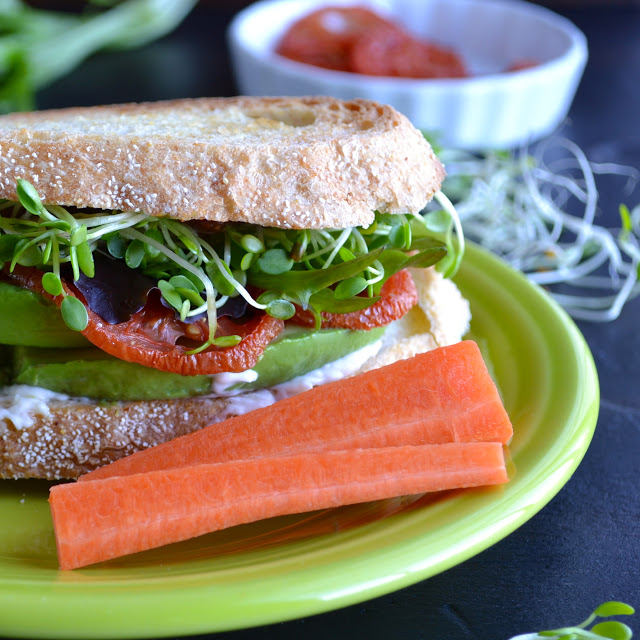 The Totally Awesome Sandwich - this completely veggie sandwich could not be more delicious or satisfying…filled with tomatoes, avocado, sprouts and a zesty topping! | @tasteLUVnourish