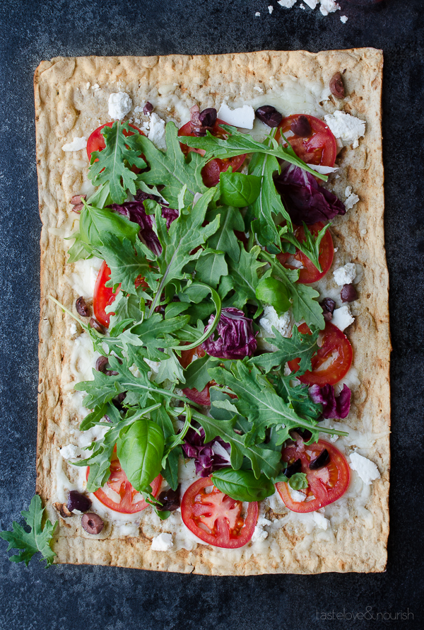 Ricotta Salata and Olive Grilled Flatbread with Kale Italia - this crisp flatbread combines the most delicious tangy, salty and fresh flavors of summer. Break out the grill or use an indoor grill pan. | @tasteLUVnourish on TasteLoveAndNourish.com
