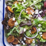Mixed Greens with Roasted Italian Plums - these roasted plums add the most delicious flavor to this early fall salad topped with bits of creamy goat cheese and toasted buttery pine nuts. | @tasteLUVnourish on TasteLoveAndNourish.com