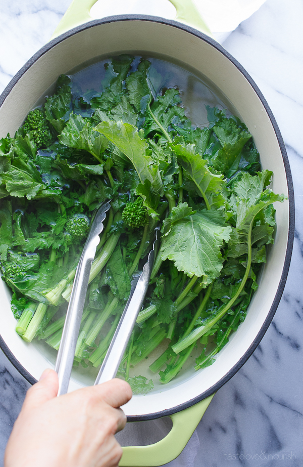 Broccoli Rabe (Rapini) with Garlic Parmesan and Lemon - use these easy steps to prepare broccoli rabe (rapini) for a great side dish. This method removes the bitterness that naturally occurs with broccoli rabe. | @tasteLUVnourish on TasteLoveAndNourish.com