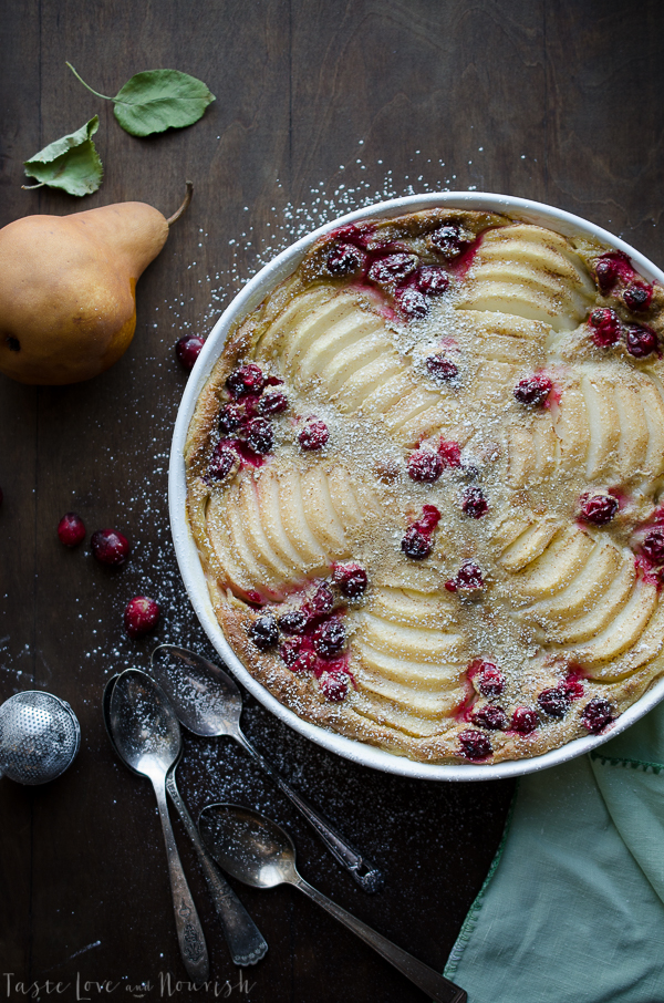 This simple Cranberry Pear Clafouti is so festive and incredibly easy. It has become a family favorite and huge crowd pleaser. You'll be handing out this recipe to everyone! | @tasteLUVnourish