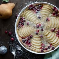 This simple Cranberry Pear Clafouti is so festive and incredibly easy. It has become a family favorite and huge crowd pleaser. You'll be handing out this recipe to everyone! | @tasteLUVnourish