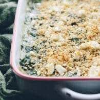 This Baked Creamed Spinach with Feta recipe is AMAZING! So easy, creamy with a bit of crunch from panko and salty bits of feta! It's actually a lightened up recipe, but you'd never know! Vegan options! @tasteLUVnourish