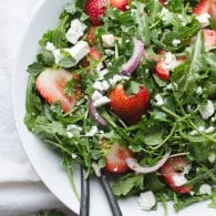 Baby Arugula and Strawberry Salad with Feta-this beautiful salad covers the spectrum of flavors and is a perfect pot luck favorite! From Caroline at Taste Love and Nourish