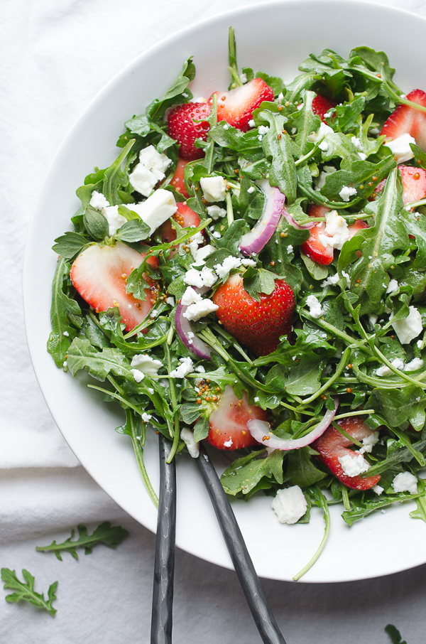 Baby Arugula and Strawberry Salad with Feta-this beautiful salad covers the spectrum of flavors and is a perfect pot luck favorite! From Caroline at Taste Love and Nourish