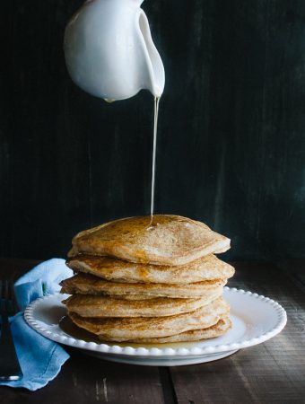 This simple Whole Wheat Vegan Pancake recipe is my family's new go-to! No one will ever guess they are vegan or made with whole wheat! Fluffy, light and delicious! @tasteLUVnourish