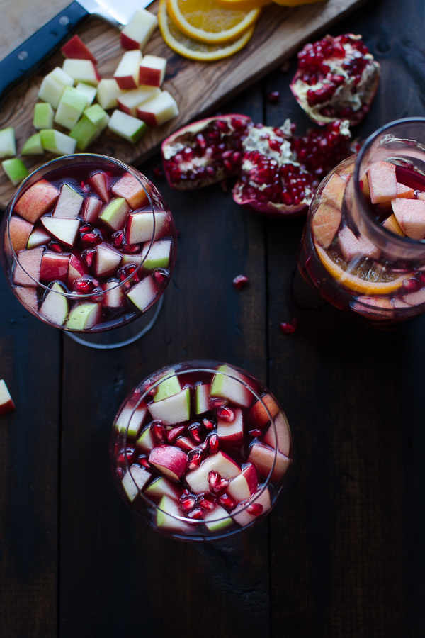 This festive Apple Pomegranate Sangria is a super simple recipe that may become you new favorite cocktail! | @tasteLUVnourish
