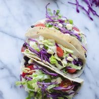Get dinner on the table in a flash with these Ten Minute Black Bean Tacos! Super simple with pantry ingredients and some fresh toppings! Vegetarian | Vegan Friendly | @tasteLUVnourish