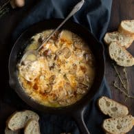This decadent Baked Mushrooms and Fontina Dip recipe is a super easy crowd pleaser! Made with white wine and some fresh thyme, this cheesy dip has amazing flavor! | @tasteLUVnourish