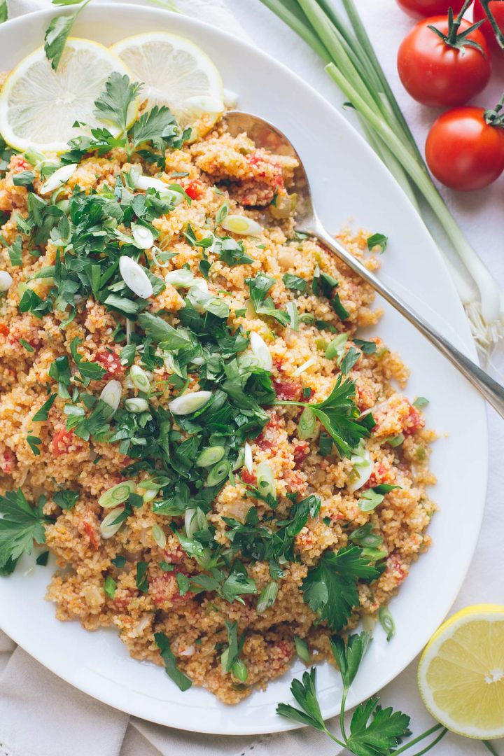 This Armenian Bulgur Salad, called Itch or Eech, is so similar to tabbouleh, but with much less parsley and much less chopping. It's such an easy, delicious fresh grain salad, filling enough for lunch or perfect as a side dish with dinner. | @tasteLUVnourish | Vegan | #immigrantfoodstories