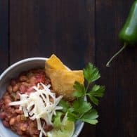 This vegetarian chili has deep smokey flavors complemented by hints of coffee and chocolate. With a bit of spice and a hint of sweetness, this may become your favorite chili! | @tasteLUVnourish | Vegetarian | Vegan | Gluten-Free