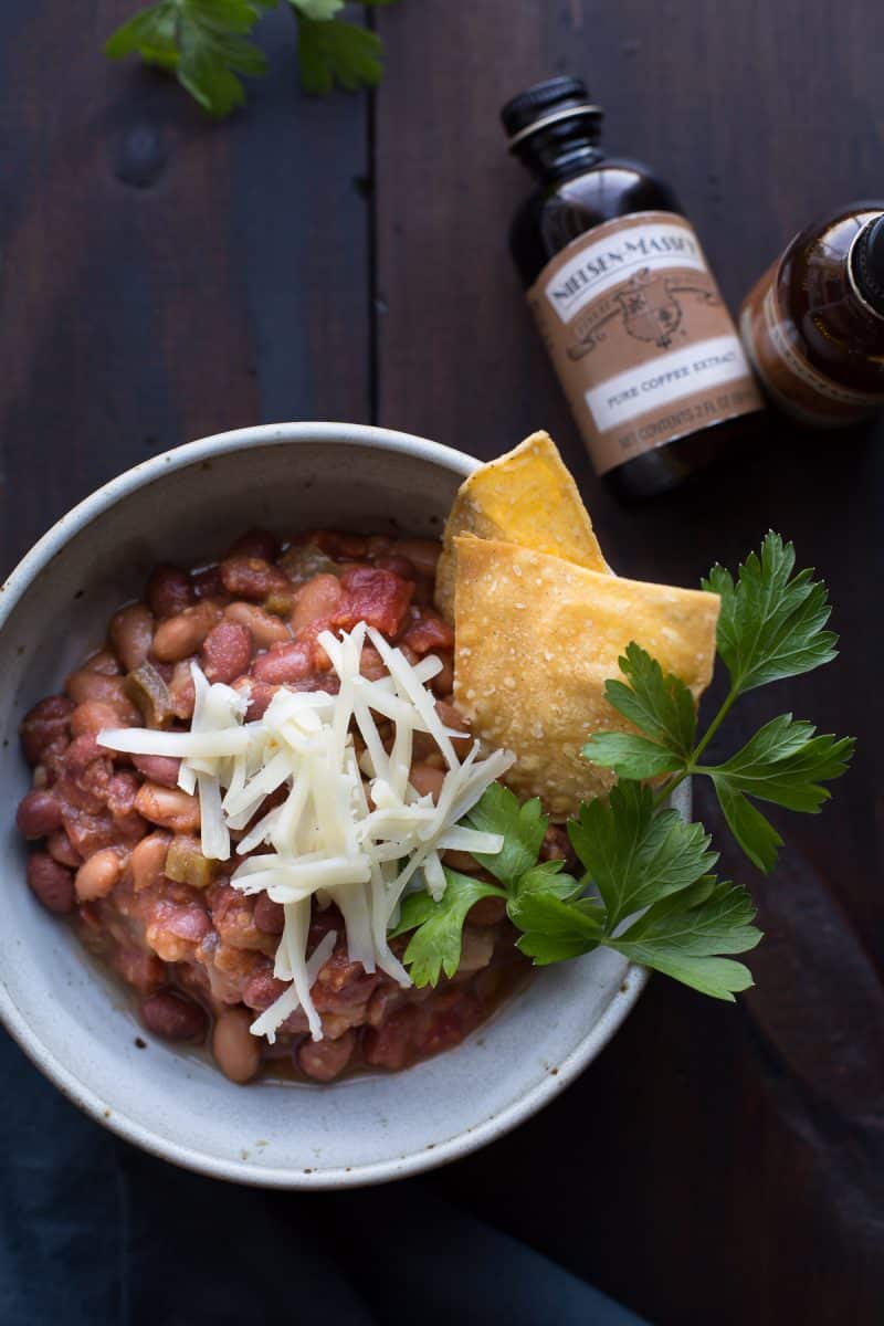 This vegetarian chili has deep smokey flavors complemented by hints of coffee and chocolate. With a bit of spice and a hint of sweetness, this may become your favorite chili! | @tasteLUVnourish | Vegetarian | Vegan | Gluten-Free