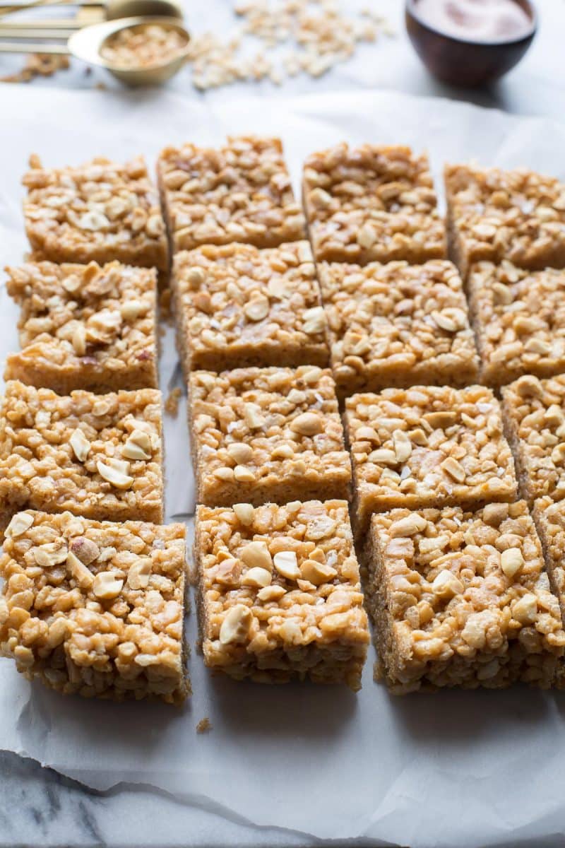 These Salted Peanut Butter Rice Crispy Treats are an easy, sweet and salty treat. Made with no refined sugars and all natural peanut butter, they are vegetarian, gluten free and paleo. From @tasteLUVnourish