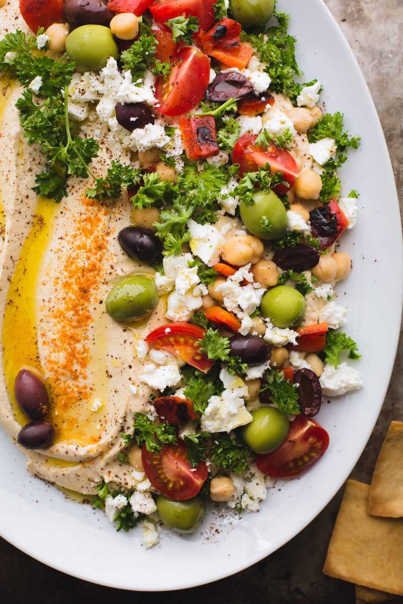 This Loaded Hummus is a great crowd-pleasing appetizer, but the hummus recipe itself is a keeper! Make this regularly and keep a container in the fridge! It's great for snacking, lunches and dinners. Naturally vegan and gluten-free. From @tasteLUVnourish