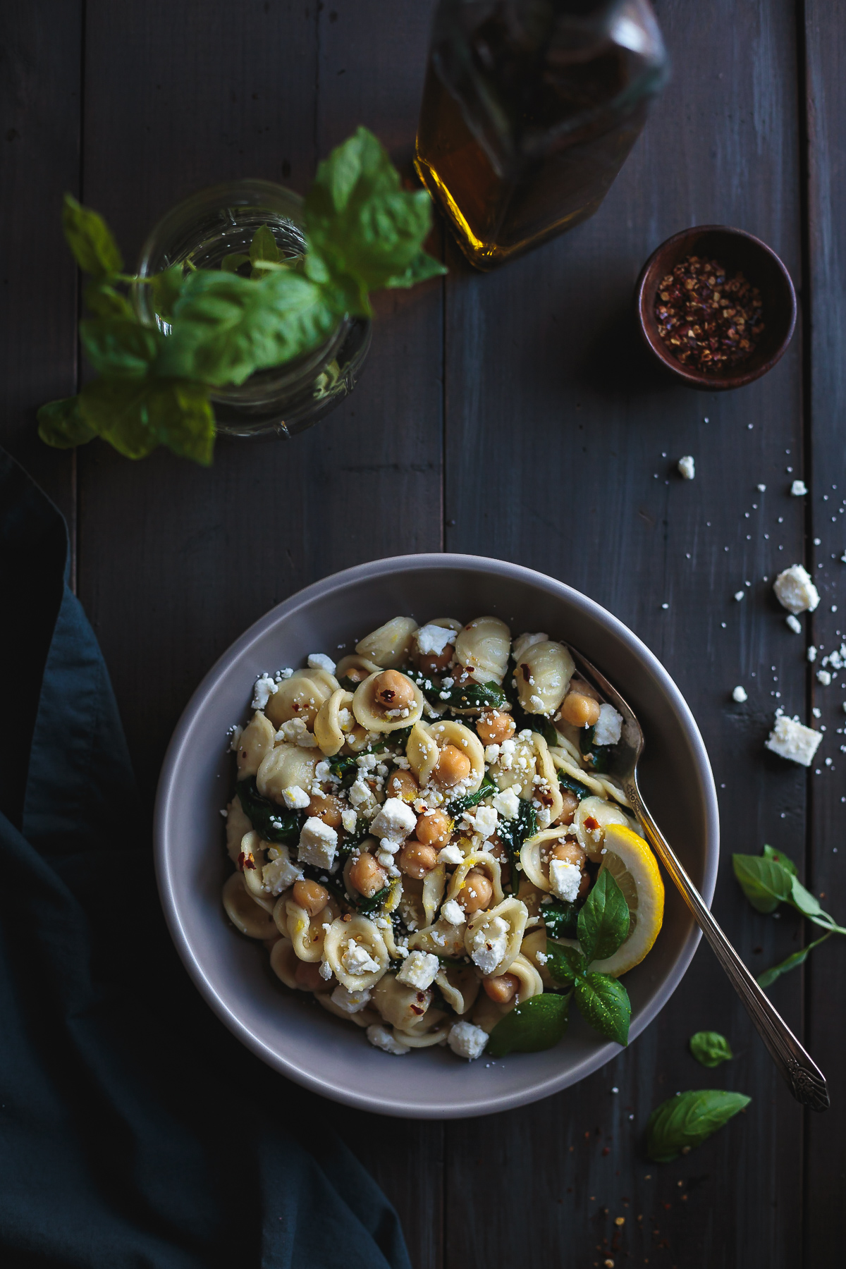 Orecchiette with Chickpeas Spinach and Feta is a simple and quick dinner that tastes incredible! In the time it takes to boil the pasta, you can prepare the rest of the ingredients and have dinner on the table in a flash. From @tasteLUVnourish #orecchiette #chickpeas #spinach #feta #easydinnerrecipes #pastarecipes