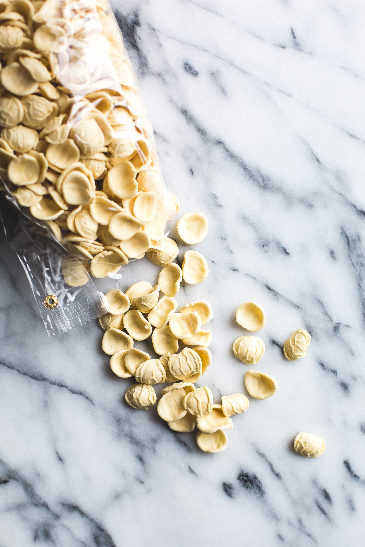 Orecchiette with Chickpeas Spinach and Feta is a simple and quick dinner that tastes incredible! In the time it takes to boil the pasta, you can prepare the rest of the ingredients and have dinner on the table in a flash. From @tasteLUVnourish #orecchiette #chickpeas #spinach #feta #easydinnerrecipes #pastarecipes