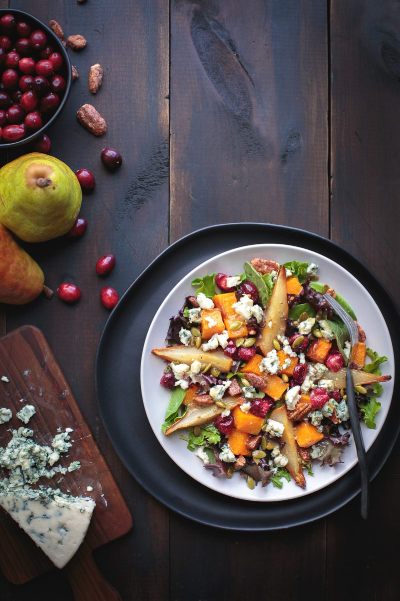 YUM! Roasted Autumn Harvest Salad is so delicious with sweet roasted pears, butternut squash and even roasted fresh cranberries! Top with some buttery pecans and salty blue cheese and you've got salad perfection! From @tasteLUVnourish #autumn #fall #salad #roasted #pears #butternut #cranberry #pecan #bluecheese #glutenfree #vegetarian #veganoptions www.tasteloveandnourish.com