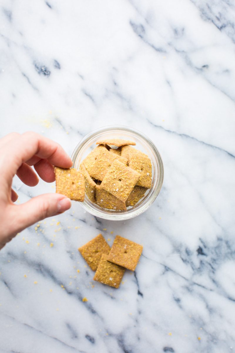 You will love these addicting Sourdough Cheese Crackers made with whole wheat flour and deliciously vegan! Keep a jar in the pantry for a savory, crunchy snack! #sourdough #cheesecrackers #crackers #vegan #recipe #healthy #snack #tasteloveandnourish
