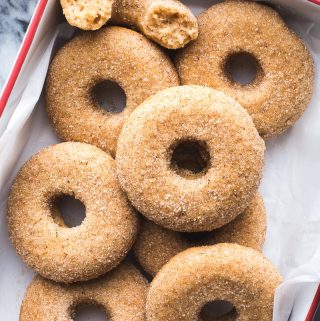 This Vegan Baked Apple Cider Donut recipe yields the tastiest donuts with lots of apple flavor and the perfect blend of spices. They'll definitely satisfy your biggest cider donut cravings! #vegan #baked #apple #cider #donut #doughnut #breakfast #snack #dessert #fall #recipe #tasteloveandnourish