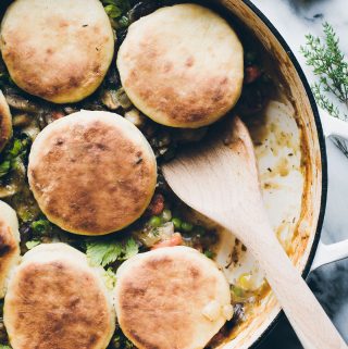 Dinner bliss in one pot! This vegan Vegetable Pot Pie topped with Olive Oil Biscuits makes a homey dinner that everyone will love. This biscuit recipe alone, is everything! #vegan #onepot #dinner #vegetable #potpie #oliveoil #biscuits #easy #healthy #recipe #tasteloveandnourish www.tasteloveandnourish.com