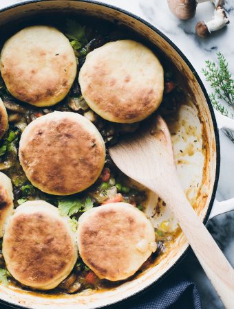 Dinner bliss in one pot! This vegan Vegetable Pot Pie topped with Olive Oil Biscuits makes a homey dinner that everyone will love. This biscuit recipe alone, is everything! #vegan #onepot #dinner #vegetable #potpie #oliveoil #biscuits #easy #healthy #recipe #tasteloveandnourish www.tasteloveandnourish.com