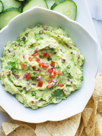 Made with both edamame and avocado, this guacamole is lower in fat and has a boost of protein compared to traditional guac. Serve this with veggies, tortilla chips or use as a spread on wraps and sandwiches. #edamame #avocado #guacamole #healthy #easy #protein #vegan #glutenfree #appetizer #spread #lunch #snack #recipe #tasteloveandnourish From www.tasteloveandnourish.com