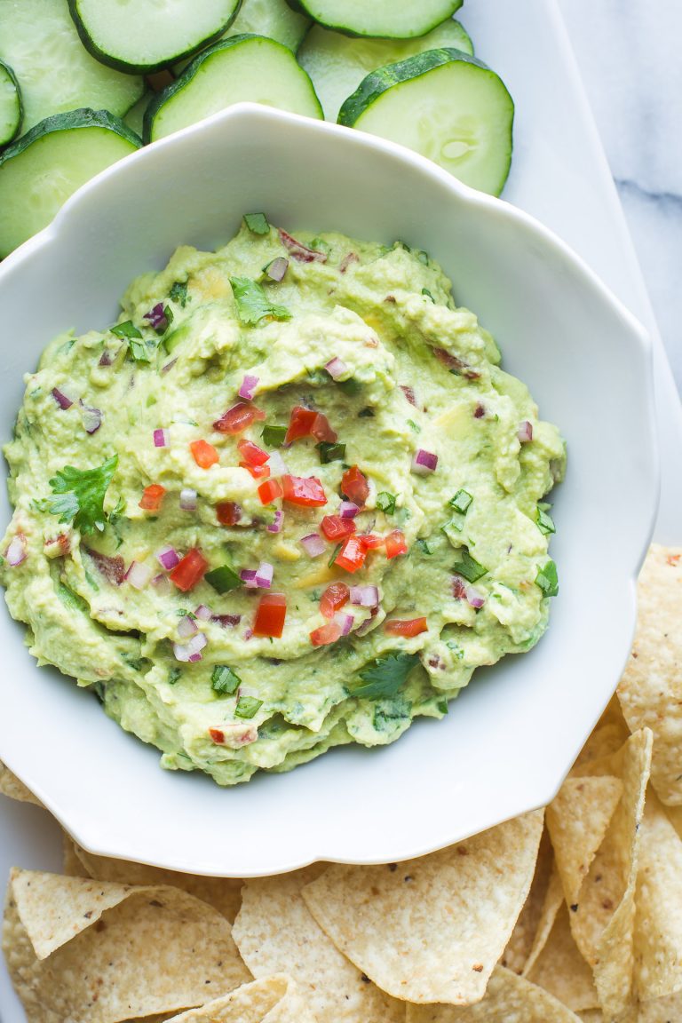 Made with both edamame and avocado, this guacamole is lower in fat and has a boost of protein compared to traditional guac. Serve this with veggies, tortilla chips or use as a spread on wraps and sandwiches. #edamame #avocado #guacamole #healthy #easy #protein #vegan #glutenfree #appetizer #spread #lunch #snack #recipe #tasteloveandnourish From www.tasteloveandnourish.com