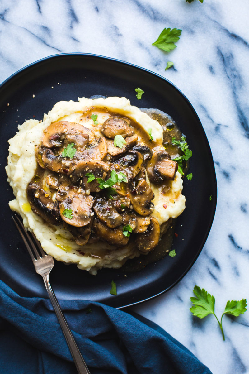 Mushroom Miso Gravy over Garlic Mashed Potatoes - This flavorful Mushroom Miso Gravy recipe over the tastiest Garlic Mashed Potatoes makes the most cozy and simple meal.  #vegan #vegetarian #glutenfree #dinner #mushrooms #gravy #mashedpotatoes #comfortfood #hearty #healthy #recipe #tasteloveandnourish