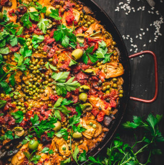 Made in one pan, this Vegetable Paella is a tasty spin on the traditional Spanish dish. It's loaded with smokey flavor and lots of veggies. Perfect for weekends and entertaining! #vegan #glutenfree #vegetarian #vegetable #paella #onepot #dinner #healthy #recipe #entertaining #tasteloveandnourish
