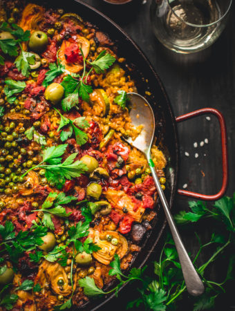Made in one pan, this Vegetable Paella is a tasty spin on the traditional Spanish dish. It's loaded with smokey flavor and lots of veggies. Perfect for weekends and entertaining! #vegan #glutenfree #vegetarian #vegetable #paella #onepot #dinner #healthy #recipe #entertaining #tasteloveandnourish