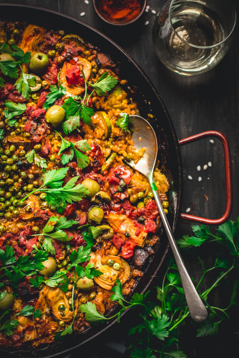 Made in one pan, this Vegetable Paella is a tasty spin on the traditional Spanish dish. It's loaded with smokey flavor and lots of veggies. Perfect for weekends and entertaining! #vegan #glutenfree #vegetarian #vegetable #paella #onepot #dinner #healthy #recipe #entertaining #tasteloveandnourish